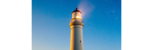 a light house with a bright light on top showing leadership